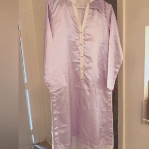 A man's traditional shirt from Middle Eastern satin with diamond gold trimming